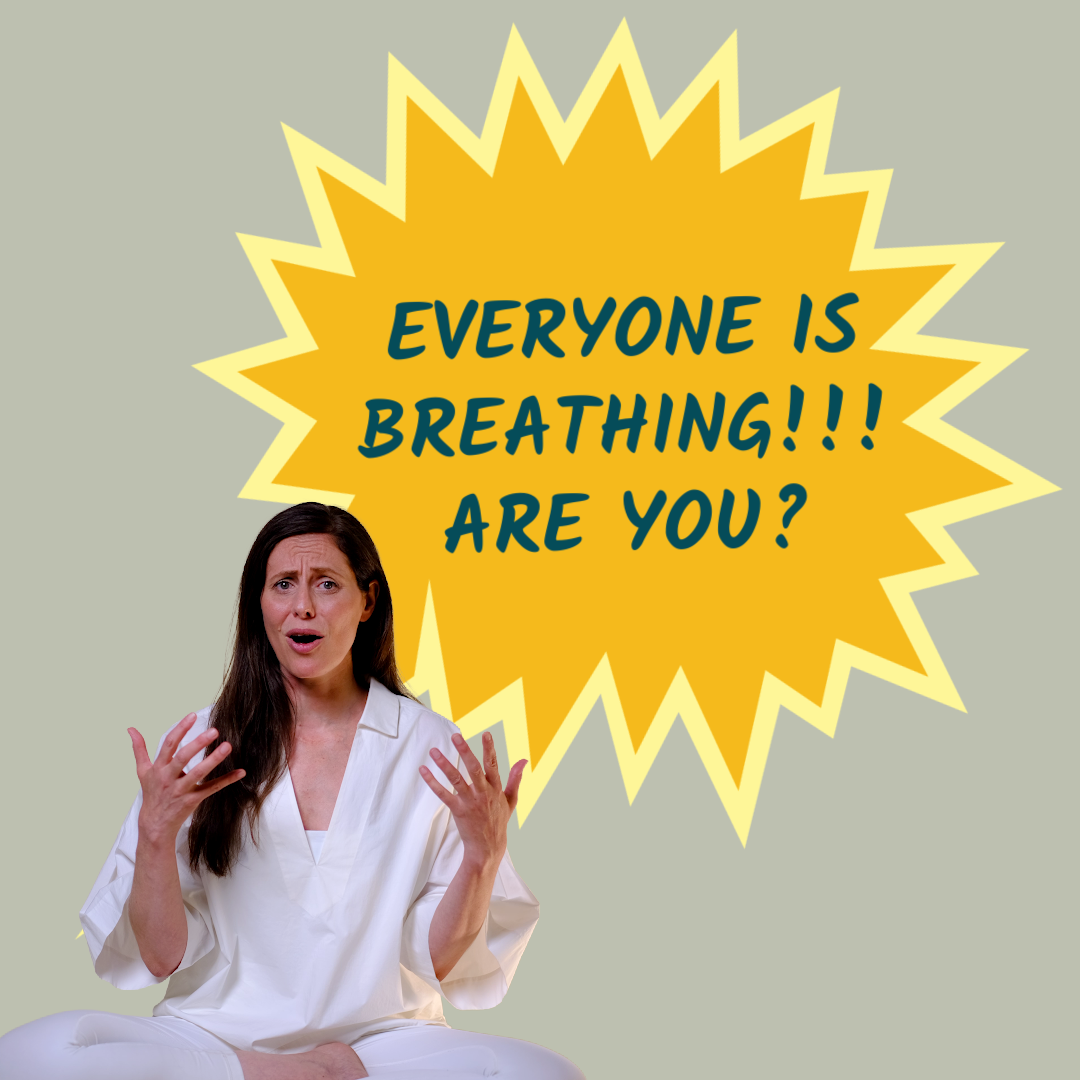 A woman in white sits with hands raised and an expressive face in front of a large yellow starburst with the words “EVERYONE IS BREATHING!!! ARE YOU?” written in blue text. The background is light gray.