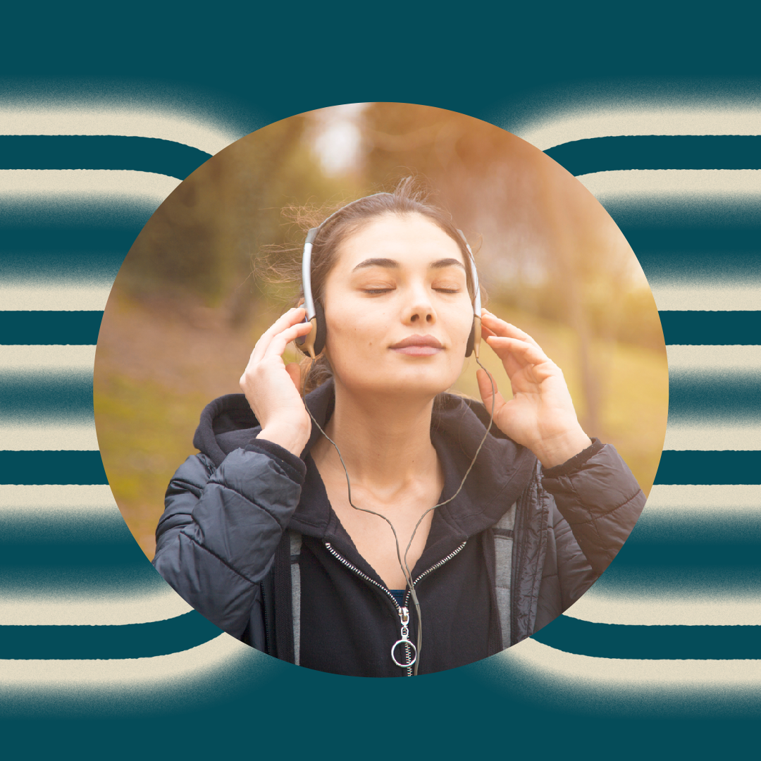 A woman wearing a black jacket and headphones stands outdoors with her eyes closed, holding the headphones to her ears. The background is blurred, and the image is set within a circular frame on a striped teal pattern.